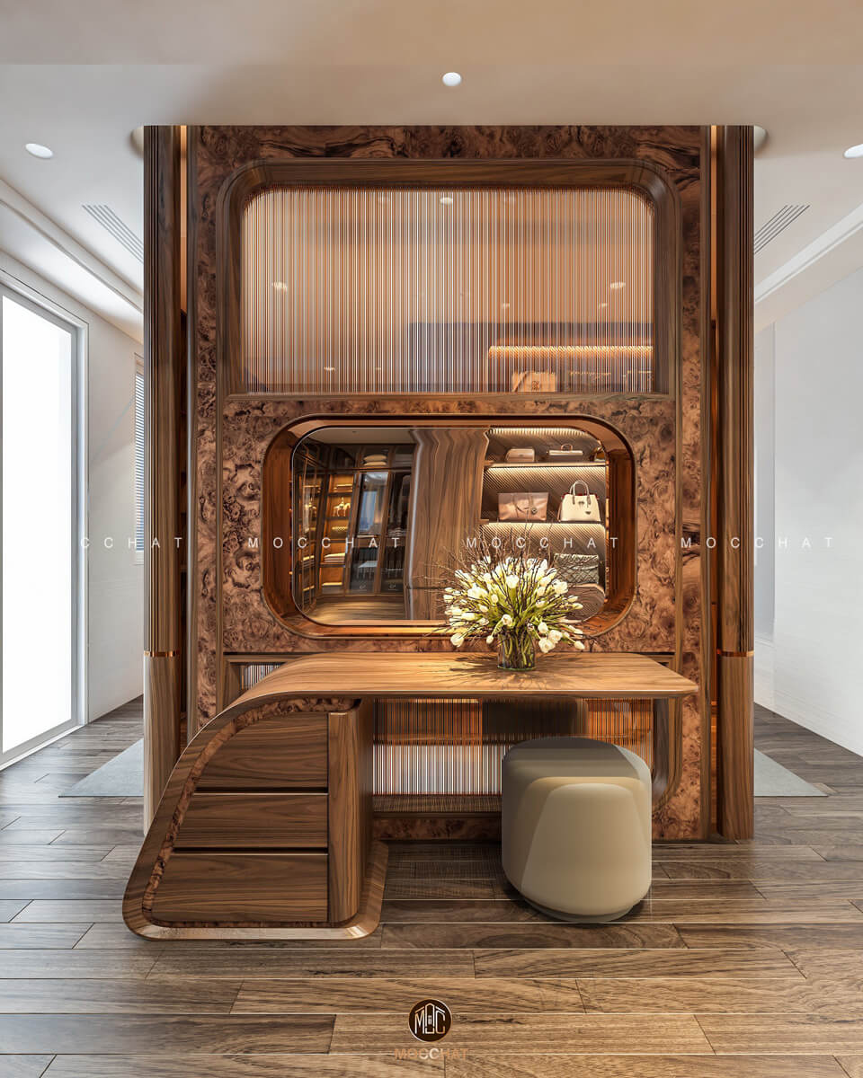 Vách ngăn tích hợp bàn trang điểm gỗ óc chó sang trọng, thiết kế tinh xảo và tiện dụng, tạo không gian đẳng cấp.